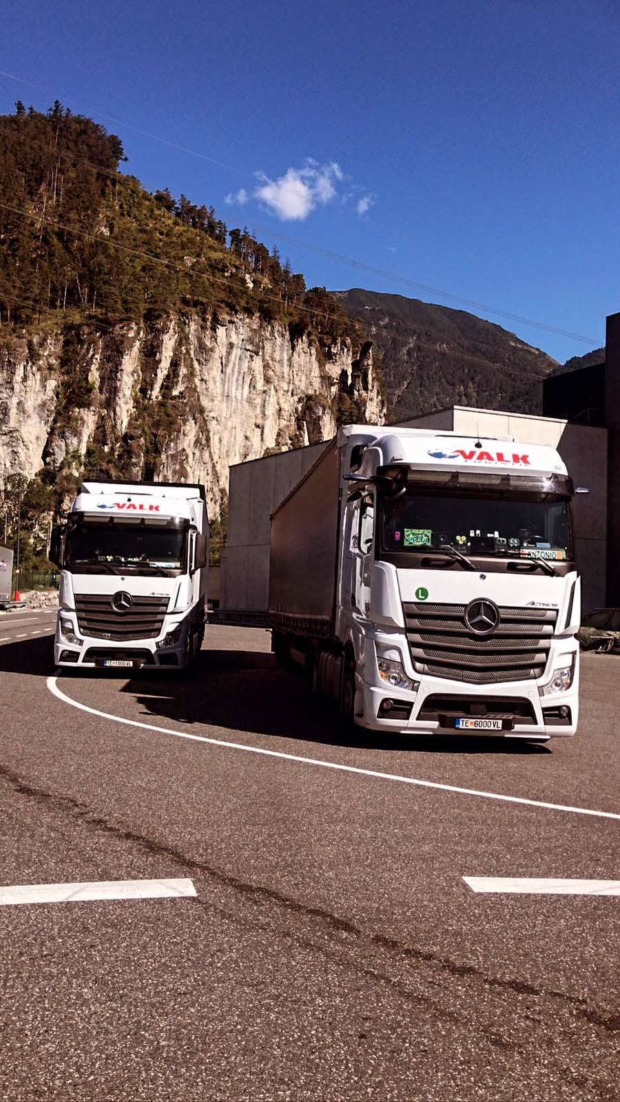 Two VALK trucks on a mountain road